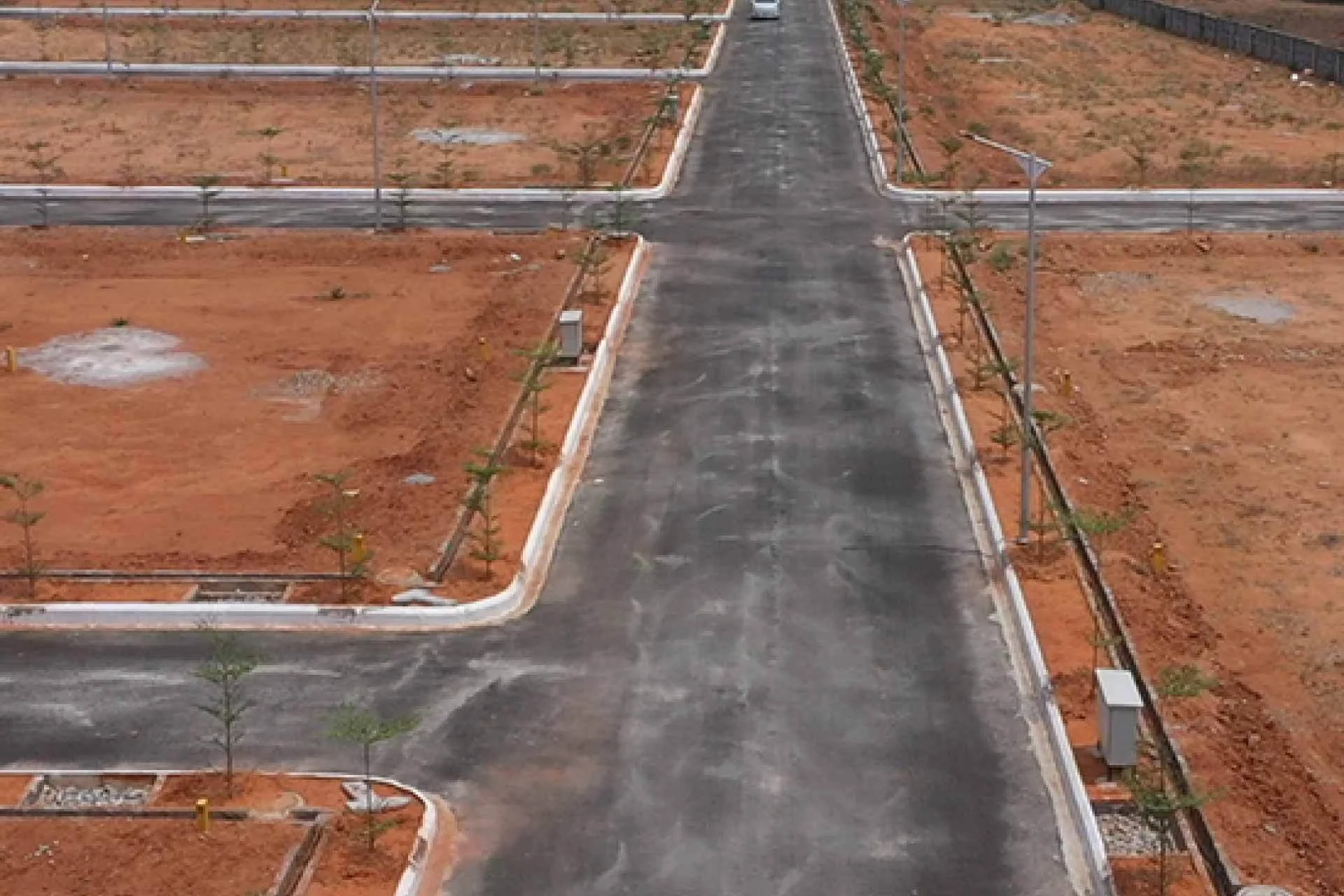 Image of land and the road along with a street light pole in Qutub valley.